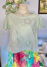 Load image into Gallery viewer, pale mint short sleeve top with 60s style stitched flowers in pastel colours and deep purple
