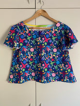 Load image into Gallery viewer, navy short sleeve top with illustrations of multicoloured birds and spots
