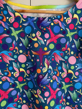 Load image into Gallery viewer, close up of navy top with illustrations of multicoloured birds and spots
